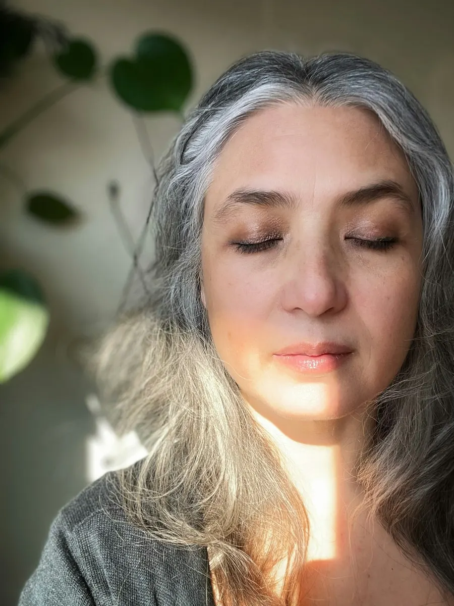 Woman with eyes closed in a quiet meditation practice